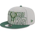 casquette-plate-grise-et-verte-snapback-9fifty-draft-edition-2023-milwaukee-bucks-nba-new-era