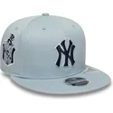 berretto-piatto-snapback-blu-con-logo-blu-marino-9fifty-original-fit-world-series-dei-new-york-yankees-mlb-di-new-era