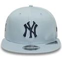 berretto-piatto-snapback-blu-con-logo-blu-marino-9fifty-original-fit-world-series-dei-new-york-yankees-mlb-di-new-era