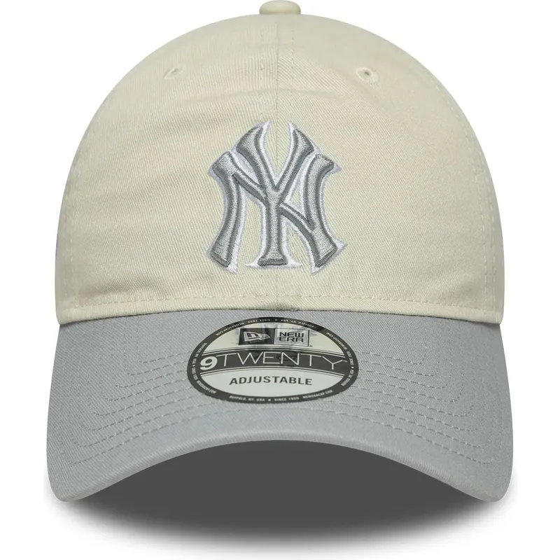 beige-og-gra-justerbar-kvindekasket-med-buet-skygge-9twenty-world-series-cooperstown-af-new-york-yankees-mlb-fra-new-era