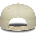cappello-piatto-beige-snapback-con-logo-blu-marino-9fifty-original-fit-world-series-dei-new-york-yankees-mlb-di-new-era