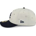 gorra-curva-beige-y-azul-marino-ajustada-59fifty-beads-na-lifestyle-f1-de-atlanta-braves-mlb-de-new-era