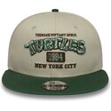 gorra-plana-verde-y-beige-snapback-para-nino-9fifty-de-tortugas-ninja-de-new-era
